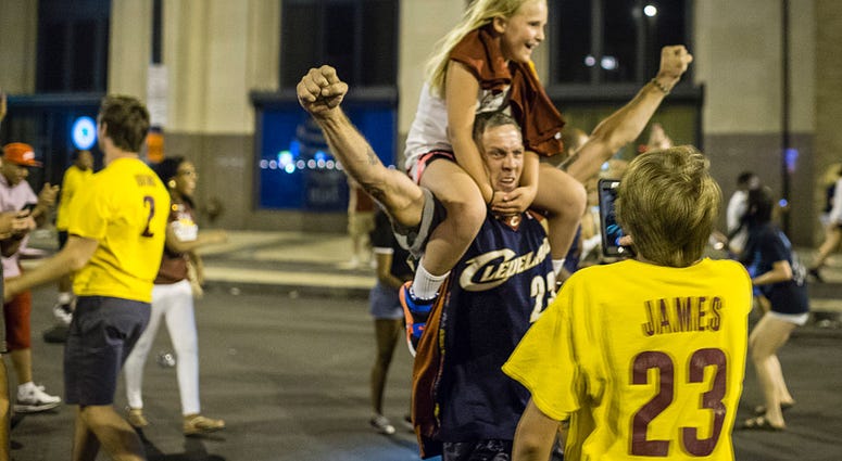 CLEVELAND, OH - JUNE 19: Cleveland Cavaliers fans celebrate in the street after the Cavaliers defeated the Golden State Warriors to win the NBA Championship on June 19, 2016 in Cleveland, Ohio. The victory brings the first professional sports championship CLEVELAND, OH - JUNE 19: Cleveland Cavaliers fans celebrate in the street after the Cavaliers defeated the Golden State Warriors to win the NBA Championship on June 19, 2016 in Cleveland, Ohio. The victory brings the first professional sports championship