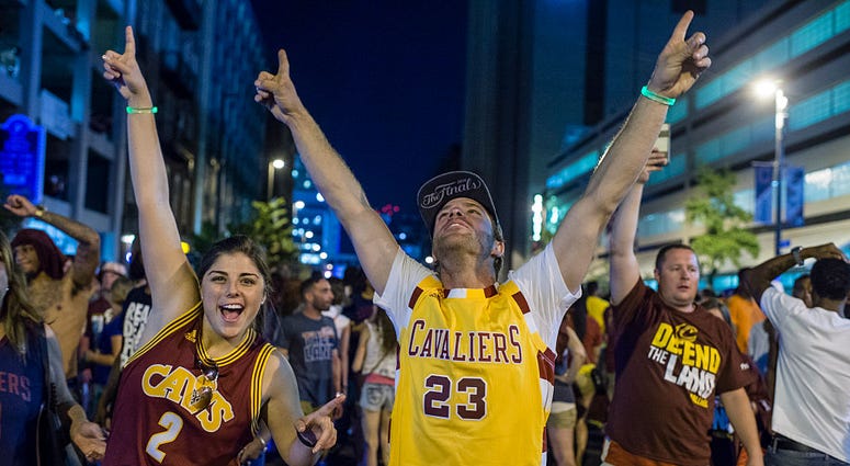 CLEVELAND, OH - JUNE 19: Cleveland Cavaliers fans celebrate in the street after the Cavaliers defeated the Golden State Warriors to win the NBA Championship on June 19, 2016 in Cleveland, Ohio. The victory brings the first professional sports championship CLEVELAND, OH - JUNE 19: Cleveland Cavaliers fans celebrate in the street after the Cavaliers defeated the Golden State Warriors to win the NBA Championship on June 19, 2016 in Cleveland, Ohio. The victory brings the first professional sports championship