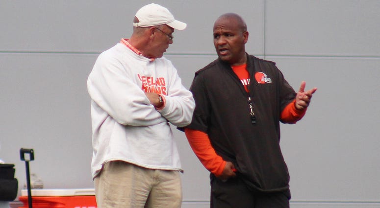 Browns general manager John Dorsey and head coach Hue Jackson speak during a training camp practice. Browns general manager John Dorsey and head coach Hue Jackson speak during a training camp practice.