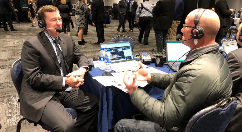 Former Cleveland Cavaliers point guard Mike Price (left) talks with Chico (right) Former Cleveland Cavaliers point guard Mike Price