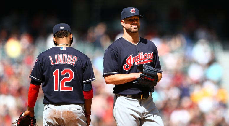Apr 9, 2017; Phoenix, AZ, USA; Cleveland Indians pitcher Corey Kluber (right) with shortstop Francisco Lindor against the Arizona Diamondbacks at Chase Field. The Diamondbacks defeated the Indians 3-2 to sweep the three game series. Mandatory Credit: Mark Apr 9, 2017; Phoenix, AZ, USA; Cleveland Indians pitcher Corey Kluber (right) with shortstop Francisco Lindor against the Arizona Diamondbacks at Chase Field. The Diamondbacks defeated the Indians 3-2 to sweep the three game series. Mandatory Credit: Mark