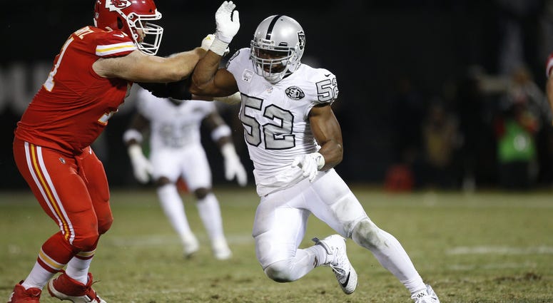 Oakland Raiders defensive end Khalil Mack (52) attempts to run past Kansas City Chiefs offensive tackle Mitchell Schwartz (71) in the fourth quarter at Oakland Coliseum. Oakland Raiders defensive end Khalil Mack (52) attempts to run past Kansas City Chiefs offensive tackle Mitchell Schwartz (71) in the fourth quarter at Oakland Coliseum.