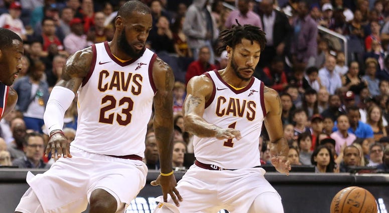 Nov 3, 2017; Washington, DC, USA; Cleveland Cavaliers forward LeBron James (23) and Cavaliers guard Derrick Rose (1) reach for a loose ball against the Washington Wizards at Capital One Arena. Mandatory Credit: Geoff Burke-USA TODAY Sports Nov 3, 2017; Washington, DC, USA; Cleveland Cavaliers forward LeBron James (23) and Cavaliers guard Derrick Rose (1) reach for a loose ball against the Washington Wizards at Capital One Arena. Mandatory Credit: Geoff Burke-USA TODAY Sports