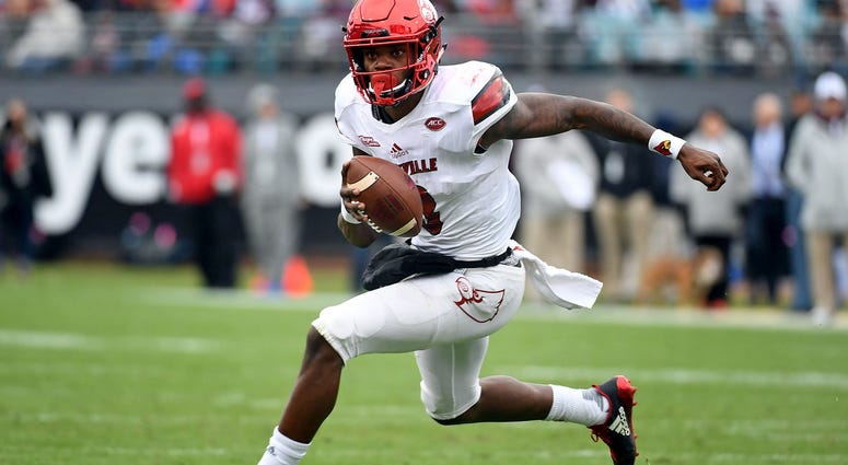 ouisville Cardinals quarterback Lamar Jackson (8) runs for a touchdown during the first half against the Mississippi State Bulldogs in the 2017 TaxSlayer Bowl ouisville Cardinals quarterback Lamar Jackson (8) runs for a touchdown during the first half against the Mississippi State Bulldogs in the 2017 TaxSlayer Bowl
