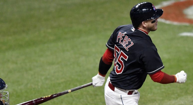 Apr 10, 2018; Cleveland, OH, USA; Cleveland Indians catcher Roberto Perez (55) hits a solo home run in the eighth inning against the Detroit Tigers at Progressive Field. Apr 10, 2018; Cleveland, OH, USA; Cleveland Indians catcher Roberto Perez (55) hits a solo home run in the eighth inning against the Detroit Tigers at Progressive Field.