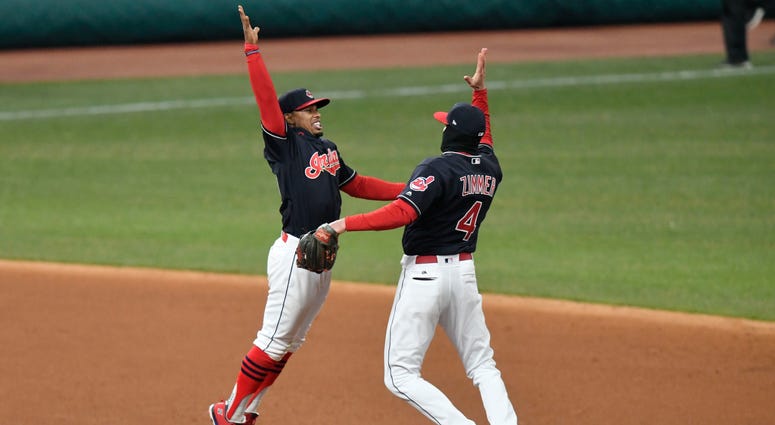 Apr 10, 2018; Cleveland, OH, USA; Cleveland Indians shortstop Francisco Lindor (12) and center fielder Bradley Zimmer (4) celebrate a win over the Detroit Tigers at Progressive Field. Apr 10, 2018; Cleveland, OH, USA; Cleveland Indians shortstop Francisco Lindor (12) and center fielder Bradley Zimmer (4) celebrate a win over the Detroit Tigers at Progressive Field.