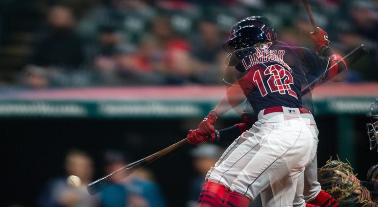 Apr 11, 2018; Cleveland, OH, USA; (Editor's note: multiple exposure) Cleveland Indians shortstop Francisco Lindor (12) hits a line drive double to left field in the eighth inning against the Detroit Tigers at Progressive Field. The Indians won 5-1. Apr 11, 2018; Cleveland, OH, USA; (Editor's note: multiple exposure) Cleveland Indians shortstop Francisco Lindor (12) hits a line drive double to left field in the eighth inning against the Detroit Tigers at Progressive Field. The Indians won 5-1.