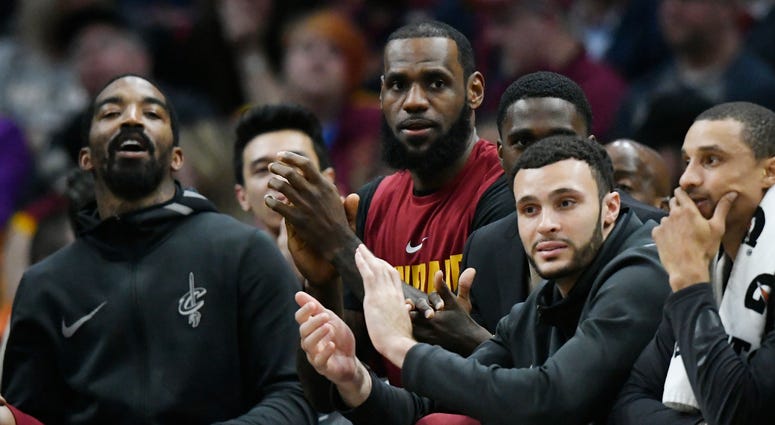 Apr 11, 2018; Cleveland, OH, USA; Cleveland Cavaliers forward LeBron James (center) sits on the bench in the fourth quarter against the New York Knicks at Quicken Loans Arena. Apr 11, 2018; Cleveland, OH, USA; Cleveland Cavaliers forward LeBron James (center) sits on the bench in the fourth quarter against the New York Knicks at Quicken Loans Arena.