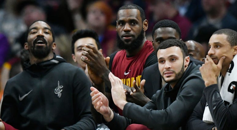 Apr 11, 2018; Cleveland, OH, USA; Cleveland Cavaliers forward LeBron James (center) sits on the bench in the fourth quarter against the New York Knicks at Quicken Loans Arena. Apr 11, 2018; Cleveland, OH, USA; Cleveland Cavaliers forward LeBron James (center) sits on the bench in the fourth quarter against the New York Knicks at Quicken Loans Arena.