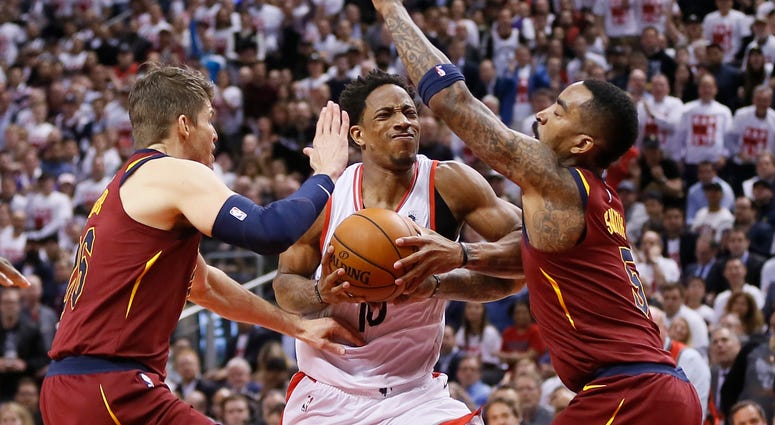Cleveland Cavaliers guard Kyle Korver (26) and guard JR Smith (5) defend against Toronto Raptors guard DeMar DeRozan (10) during game one of the second round of the 2018 NBA Playoffs at Air Canada Centre. Cleveland Cavaliers guard Kyle Korver (26) and guard JR Smith (5) defend against Toronto Raptors guard DeMar DeRozan (10) during game one of the second round of the 2018 NBA Playoffs at Air Canada Centre.