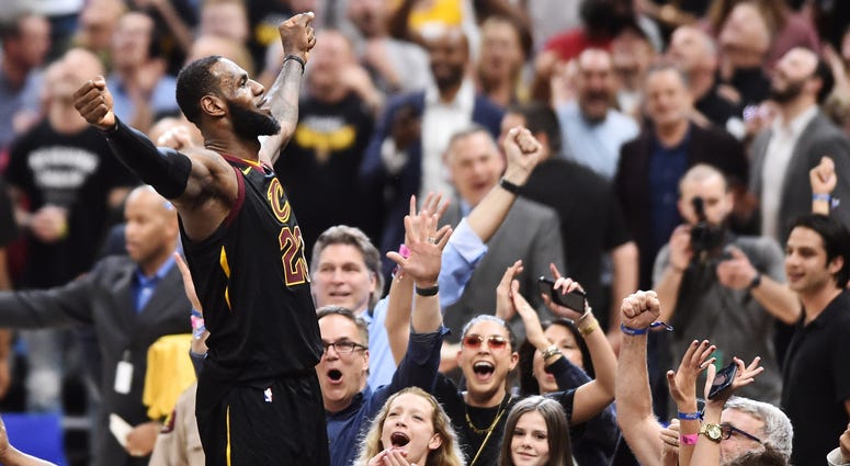 May 5, 2018; Cleveland, OH, USA; Cleveland Cavaliers forward LeBron James (23) stands on the scorer's table after hitting the final shot to win the game against the Toronto Raptors in game three of the second round of the 2018 NBA Playoffs at Quicken Loan May 5, 2018; Cleveland, OH, USA; Cleveland Cavaliers forward LeBron James (23) stands on the scorer's table after hitting the final shot to win the game against the Toronto Raptors in game three of the second round of the 2018 NBA Playoffs at Quicken Loan
