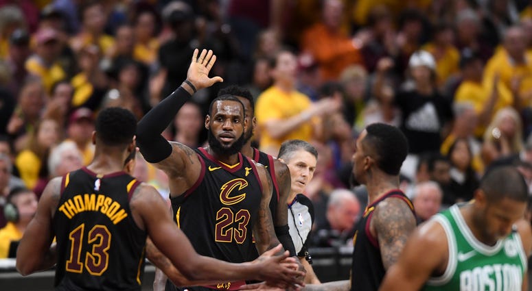 Cavaliers forward LeBron James (23) high-fives center Tristan Thompson (13) in front of Boston Celtics forward Al Horford (42) during the third quarter in game four of the Eastern conference finals of the 2018 NBA Playoffs at Quicken Loans Arena Cavaliers forward LeBron James (23) high-fives center Tristan Thompson (13) in front of Boston Celtics forward Al Horford (42) during the third quarter in game four of the Eastern conference finals of the 2018 NBA Playoffs at Quicken Loans Arena