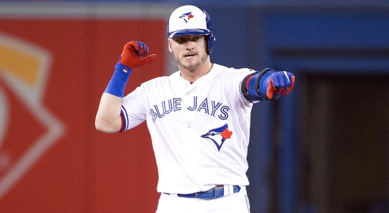 Toronto Blue Jays third baseman Josh Donaldson (20) celebrates hitting a double during the first inning against the Los Angeles Angels at Rogers Centre. Toronto Blue Jays third baseman Josh Donaldson (20) celebrates hitting a double during the first inning against the Los Angeles Angels at Rogers Centre.