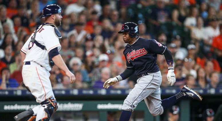 May 19, 2018; Houston, TX, USA; Cleveland Indians center fielder Rajai Davis (26) scores a run as Houston Astros catcher Brian McCann (16) looks on during the fifth inning at Minute Maid Park. May 19, 2018; Houston, TX, USA; Cleveland Indians center fielder Rajai Davis (26) scores a run as Houston Astros catcher Brian McCann (16) looks on during the fifth inning at Minute Maid Park.