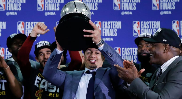 May 27, 2018; Boston, MA, USA; Cleveland Cavaliers head coach Tyronn Lue holds up the Eastern Conference trophy after defeating the Boston Celtics in the 2018 NBA Playoffs at TD Garden. Mandatory Credit: David Butler II-USA TODAY Sports May 27, 2018; Boston, MA, USA; Cleveland Cavaliers head coach Tyronn Lue holds up the Eastern Conference trophy after defeating the Boston Celtics in the 2018 NBA Playoffs at TD Garden. Mandatory Credit: David Butler II-USA TODAY Sports