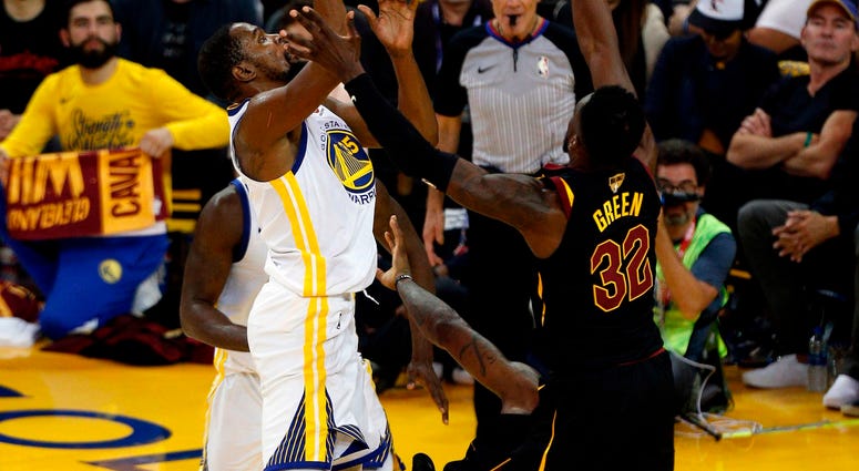 May 31, 2018; Oakland, CA, USA; Golden State Warriors forward Kevin Durant (35) collides with Cleveland Cavaliers forward LeBron James (23) on a scoring drive during the second half in game one of the 2018 NBA Finals at Oracle Arena. May 31, 2018; Oakland, CA, USA; Golden State Warriors forward Kevin Durant (35) collides with Cleveland Cavaliers forward LeBron James (23) on a scoring drive during the second half in game one of the 2018 NBA Finals at Oracle Arena.
