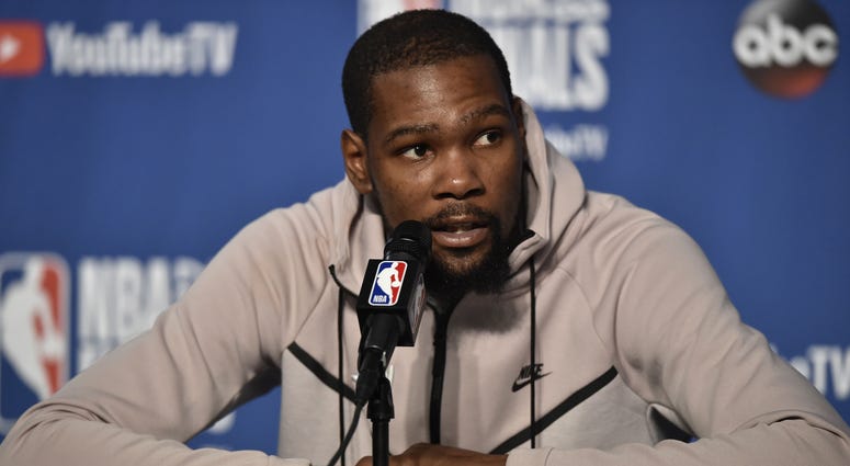Jun 6, 2018; Cleveland, OH, USA; Golden State Warriors forward Kevin Durant (35) speaks to the media after game three of the 2018 NBA Finals at Quicken Loans Arena. Jun 6, 2018; Cleveland, OH, USA; Golden State Warriors forward Kevin Durant (35) speaks to the media after game three of the 2018 NBA Finals at Quicken Loans Arena.