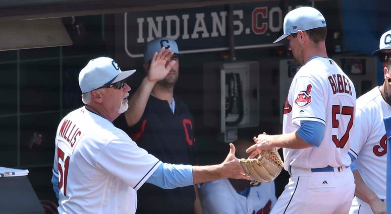 Jun 17, 2018; Cleveland, OH, USA; Cleveland Indians pitching coach Carl Willis (51) congratulates starting pitcher Shane Bieber (57) in the sixth inning against the Minnesota Twins at Progressive Field. Jun 17, 2018; Cleveland, OH, USA; Cleveland Indians pitching coach Carl Willis (51) congratulates starting pitcher Shane Bieber (57) in the sixth inning against the Minnesota Twins at Progressive Field.