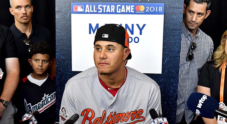 American League infielder Manny Machado of the Baltimore Orioles (13) talks with reporters during workouts in preparation for the 2018 MLB All Star Game at Nationals Ballpark. American League infielder Manny Machado of the Baltimore Orioles (13) talks with reporters during workouts in preparation for the 2018 MLB All Star Game at Nationals Ballpark.