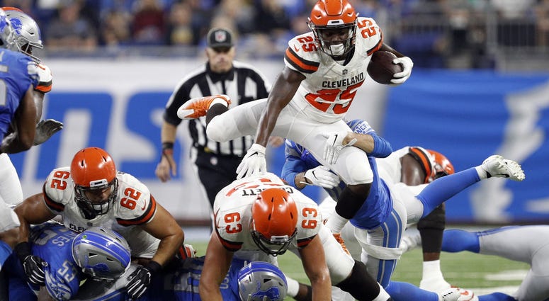 Cleveland Browns running back Dontrell Hilliard (25) hurdles players during the second quarter against the Detroit Lions at Ford Field. Dontrell Hilliard Cleveland Browns