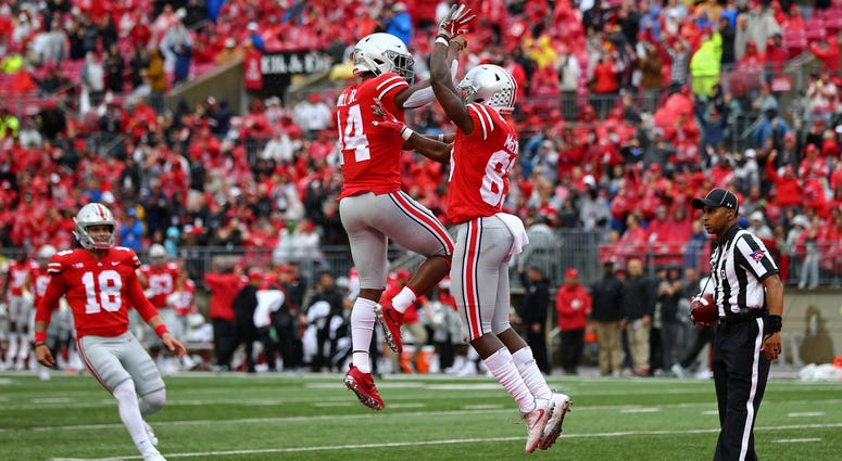 Ohio State Buckeyes wide receiver Terry McLaurin (83) celebrates scoring a touchdown with wide receiver K.J. Hill (14) against the Rutgers Scarlet Knights in the first half at Ohio Stadium. Ohio State Buckeyes wide receiver Terry McLaurin (83) celebrates scoring a touchdown with wide receiver K.J. Hill (14) against the Rutgers Scarlet Knights in the first half at Ohio Stadium.
