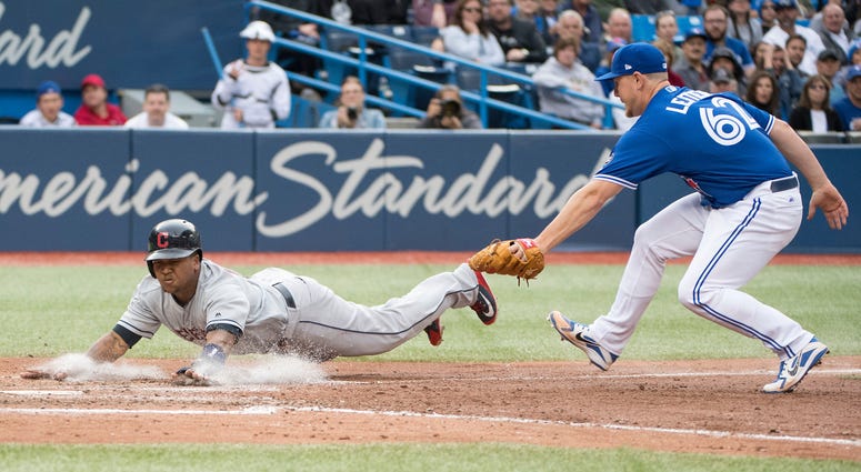 Sep 8, 2018; Toronto, Ontario, CAN; Cleveland Indians third baseman Jose Ramirez (11) slides into home plate ahead of the tag from Toronto Blue Jays relief pitcher Mark Leiter Jr. (62) during the sixth inning at Rogers Centre. Sep 8, 2018; Toronto, Ontario, CAN; Cleveland Indians third baseman Jose Ramirez (11) slides into home plate ahead of the tag from Toronto Blue Jays relief pitcher Mark Leiter Jr. (62) during the sixth inning at Rogers Centre.