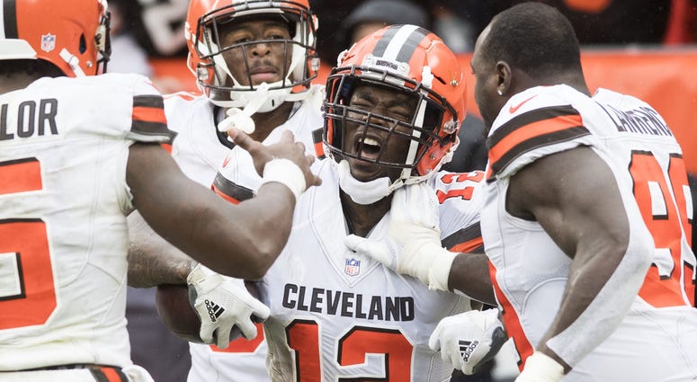 Cleveland Browns wide receiver Josh Gordon (12) celebrates with quarterback Tyrod Taylor (5) and defensive tackle Devaroe Lawrence (99) after catching a touchdown during the fourth quarter at FirstEnergy Stadium. Cleveland Browns wide receiver Josh Gordon (12) celebrates with quarterback Tyrod Taylor (5) and defensive tackle Devaroe Lawrence (99) after catching a touchdown during the fourth quarter at FirstEnergy Stadium.