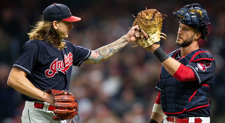 Sep 22, 2018; Cleveland, OH, USA; Cleveland Indians starting pitcher Mike Clevinger (52) high fives catcher Yan Gomes (7) following the third out of the top of the the third inning at Progressive Field. Sep 22, 2018; Cleveland, OH, USA; Cleveland Indians starting pitcher Mike Clevinger (52) high fives catcher Yan Gomes (7) following the third out of the top of the the third inning at Progressive Field.