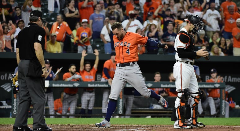 Houston Astros center fielder George Springer (4) scores on Houston Astros shortstop Carlos Correa (not pictured) rbi double in the ninth inning \H| at Oriole Park at Camden Yards. Houston Astros center fielder George Springer (4) scores on Houston Astros shortstop Carlos Correa (not pictured) rbi double in the ninth inning \H| at Oriole Park at Camden Yards.