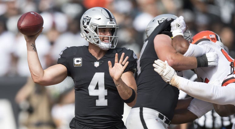 Oakland Raiders quarterback Derek Carr (4) passes the football against the Cleveland Browns during the second quarter at Oakland Coliseum. Derek Carr Oakland Raiders Cleveland Browns
