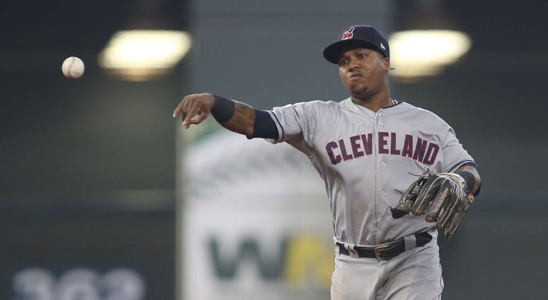 Cleveland Indians second baseman Jose Ramirez (11) throws out Houston Astros catcher Martin Maldonado (not pictured) on a ground ball during the third inning in game one of the 2018 ALDS playoff baseball series at Minute Maid Park. Jose Ramirez Cleveland Indians ALDS Game 1