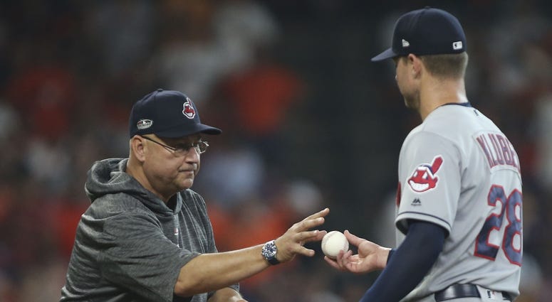 Cleveland Indians manager Terry Francona (left) removes starting pitcher Corey Kluber (28) during the fifth inning in game one of the 2018 ALDS playoff baseball series against the Houston Astros at Minute Maid Park. Terry Francona Corey Kluber