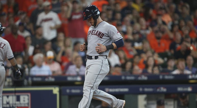 Cleveland Indians catcher Yan Gomes (7) scores a run on a wild pitch by Houston Astros relief pitcher Ryan Pressly (not pictured) during the sixth inning in game one of the 2018 ALDS Yan Gomes Game 1 ALDS