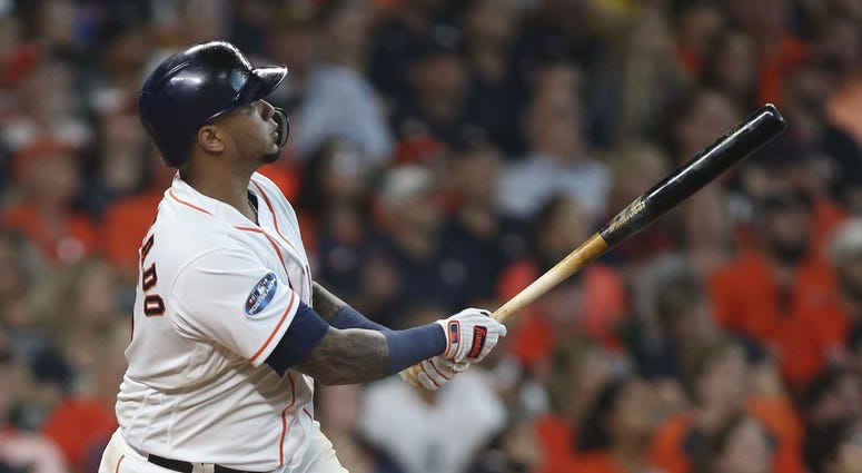 Houston Astros catcher Martin Maldonado (15) hits a solo home run during the seventh inning in game one of the 2018 ALDS playoff baseball series against the Cleveland Indians at Minute Maid Park.