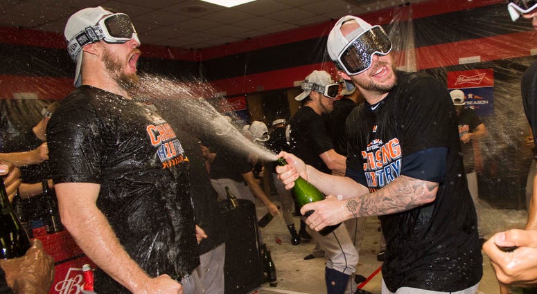 Oct 8, 2018; Cleveland, OH, USA; Members of the Houston Astros celebrate in the locker room after game three of the 2018 ALDS playoff baseball series against the Cleveland Indians at Progressive Field. Oct 8, 2018; Cleveland, OH, USA; Members of the Houston Astros celebrate in the locker room after game three of the 2018 ALDS playoff baseball series against the Cleveland Indians at Progressive Field.