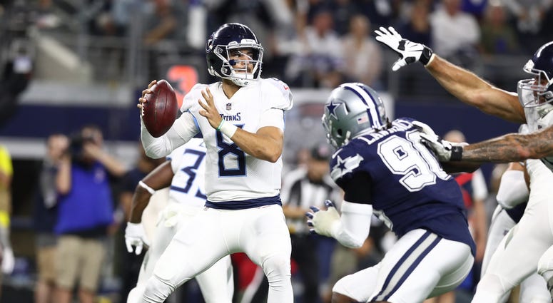 Tennessee Titans quarterback Marcus Mariota (8) throws in the pocket against the Dallas Cowboys at AT&T Stadium