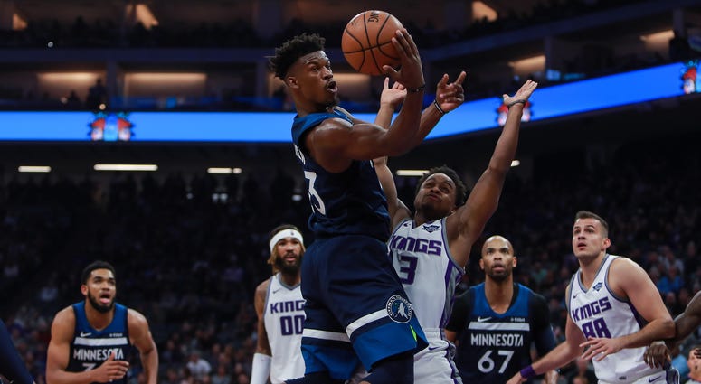 Minnesota Timberwolves guard Jimmy Butler (23) passes the ball against Sacramento Kings guard Yogi Ferrell (3) during the second quarter at Golden 1 Center. Minnesota Timberwolves guard Jimmy Butler (23) passes the ball against Sacramento Kings guard Yogi Ferrell (3) during the second quarter at Golden 1 Center.