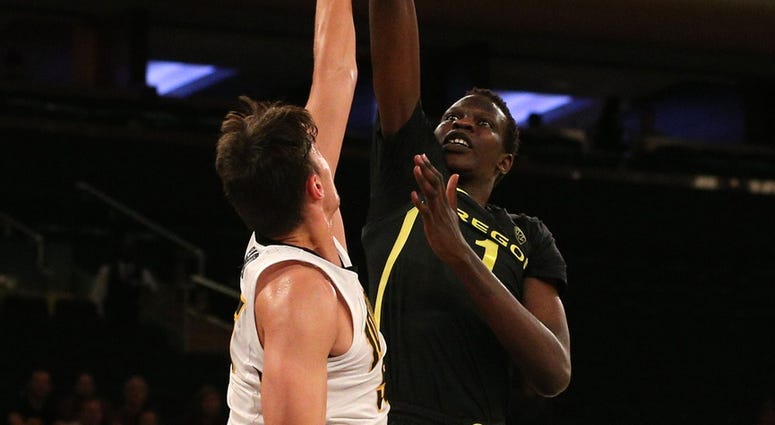 Oregon Ducks center Bol Bol (1) shoots against Iowa Hawkeyes forward Luka Garza (55) during the second half at Madison Square Garden. Oregon Ducks center Bol Bol (1) shoots against Iowa Hawkeyes forward Luka Garza (55) during the second half at Madison Square Garden.