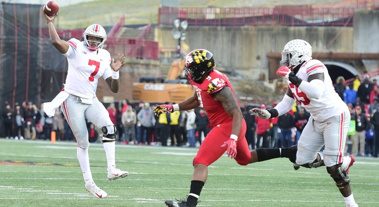 Ohio State Buckeyes quarterback Dwayne Haskins (7) throws as Ohio State Buckeyes defensive end Jashon Cornell (9) applies pressure during the fourth quarter at Capital One Field at Maryland Stadium. Ohio State Buckeyes quarterback Dwayne Haskins (7) throws as Ohio State Buckeyes defensive end Jashon Cornell (9) applies pressure during the fourth quarter at Capital One Field at Maryland Stadium.