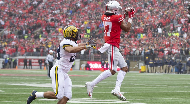 Ohio State Buckeyes wide receiver Chris Olave (17) catches his second touchdown pass of the game in front of Michigan Wolverines defensive back Brandon Watson (28) at Ohio Stadium. Chris Olave Ohio State
