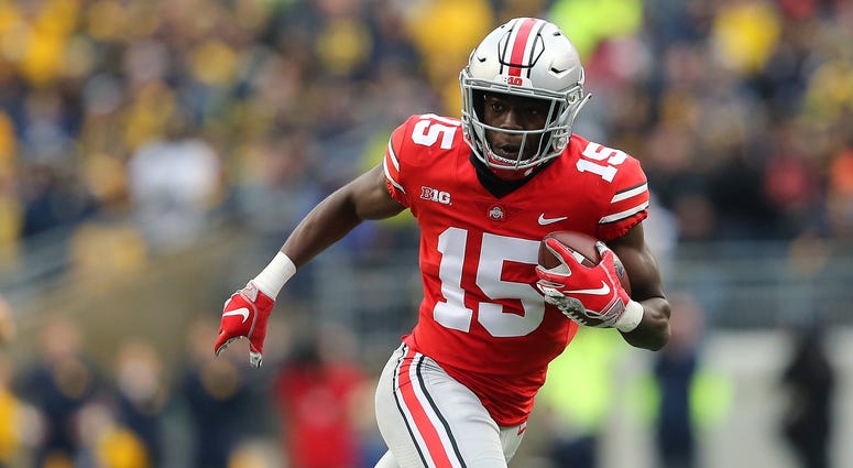Ohio State Buckeyes cornerback Sevyn Banks (12) recovers a blocked punt and returns it for a touchdown during the third quarter against the Michigan Wolverines at Ohio Stadium. Sevyn Banks Ohio State