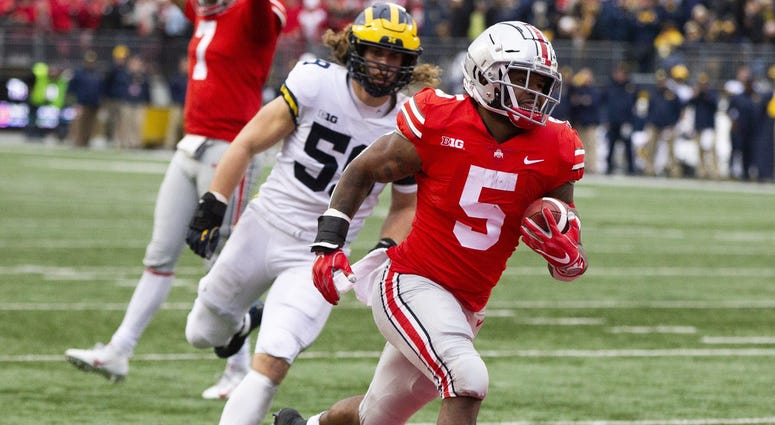 Ohio State Buckeyes running back Mike Weber (5) scores against Michigan Wolverines linebacker Noah Furbush (59) at Ohio Stadium. Mike Weber Ohio State