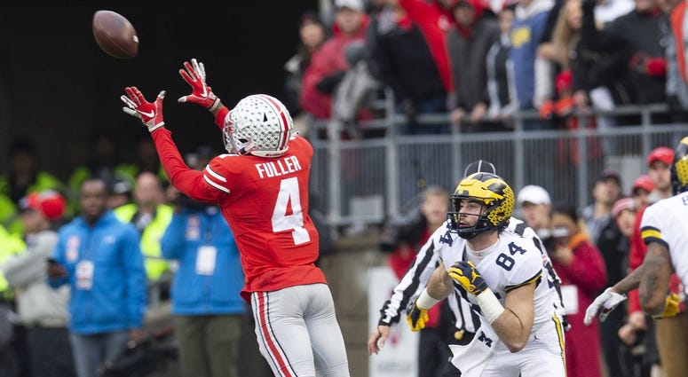 Michigan Wolverines tight end Sean McKeon (84) looks on as Ohio State Buckeyes safety Jordan Fuller (4) intercepts a pass at Ohio Stadium. Jordan Fuller Ohio State