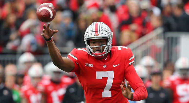 Ohio State Buckeyes quarterback Dwayne Haskins (7) throws a touchdown pass during the fourth quarter against the Michigan Wolverines at Ohio Stadium. Dwayne Haskins Ohio State