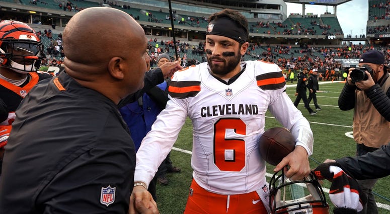 Cincinnati Bengals special assistant to the head coach Hue Jackson (left) meets with Cleveland Browns quarterback Baker Mayfield (6) after their game at Paul Brown Stadium