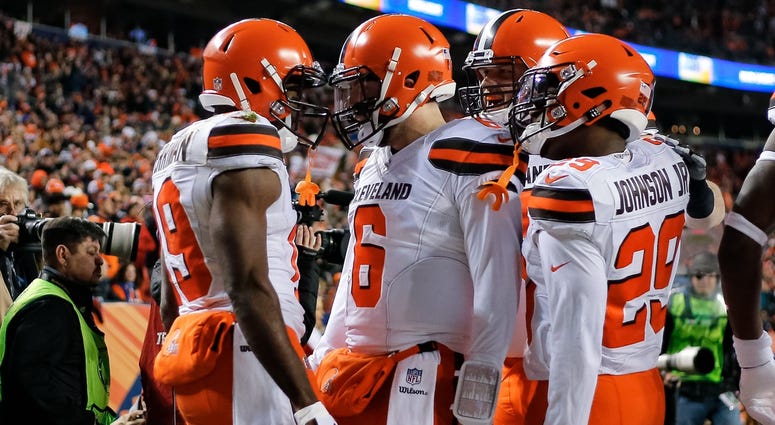 Cleveland Browns quarterback Baker Mayfield (6) celebrates with wide receiver Breshad Perriman (19) and running back Duke Johnson Jr. (29) after a touchdown in the first quarter against the Denver Broncos at Broncos Stadium at Mile High.