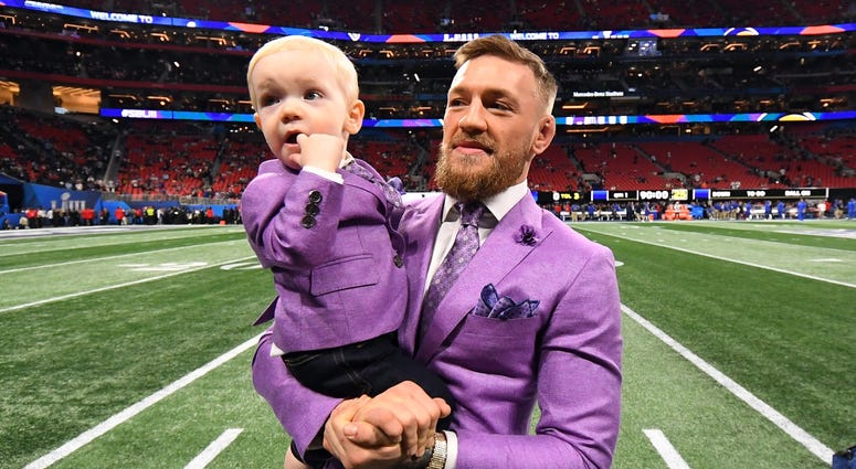 Feb 3, 2019; Atlanta, GA, USA; UFC fighter Conor McGregor holds his son Conor Jack McGregor Jr. on the sidelines before Super Bowl LIII between the New England Patriots and the Los Angeles Rams at Mercedes-Benz Stadium. Mandatory Credit: Christopher Hanew Feb 3, 2019; Atlanta, GA, USA; UFC fighter Conor McGregor holds his son Conor Jack McGregor Jr. on the sidelines before Super Bowl LIII between the New England Patriots and the Los Angeles Rams at Mercedes-Benz Stadium. Mandatory Credit: Christopher Hanew
