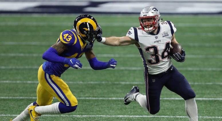 Feb 3, 2019; Atlanta, GA, USA; New England Patriots running back Rex Burkhead (34) breaks the tackled of Los Angeles Rams strong safety John Johnson (43) during the first quarter in Super Bowl LIII at Mercedes-Benz Stadium. Mandatory Credit: Brett Davis-U Feb 3, 2019; Atlanta, GA, USA; New England Patriots running back Rex Burkhead (34) breaks the tackled of Los Angeles Rams strong safety John Johnson (43) during the first quarter in Super Bowl LIII at Mercedes-Benz Stadium. Mandatory Credit: Brett Davis-U