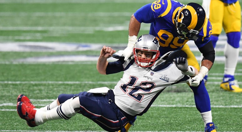 Feb 3, 2019; Atlanta, GA, USA; Los Angeles Rams defensive end Aaron Donald (99) takes down New England Patriots quarterback Tom Brady (12) during the second quarter in Super Bowl LIII at Mercedes-Benz Stadium. Mandatory Credit: Dale Zanine-USA TODAY Sport Feb 3, 2019; Atlanta, GA, USA; Los Angeles Rams defensive end Aaron Donald (99) takes down New England Patriots quarterback Tom Brady (12) during the second quarter in Super Bowl LIII at Mercedes-Benz Stadium. Mandatory Credit: Dale Zanine-USA TODAY Sport