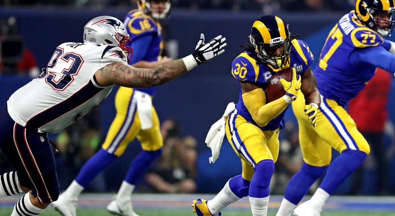 Feb 3, 2019; Atlanta, GA, USA; Los Angeles Rams running back Todd Gurley (30) runs the ball against New England Patriots defensive tackle Lawrence Guy (93) in Super Bowl LIII at Mercedes-Benz Stadium. Mandatory Credit: Matthew Emmons-USA TODAY Sports Feb 3, 2019; Atlanta, GA, USA; Los Angeles Rams running back Todd Gurley (30) runs the ball against New England Patriots defensive tackle Lawrence Guy (93) in Super Bowl LIII at Mercedes-Benz Stadium. Mandatory Credit: Matthew Emmons-USA TODAY Sports